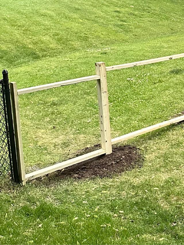 Close-up of terminating 2x4 with poor dig spot and dirt mound